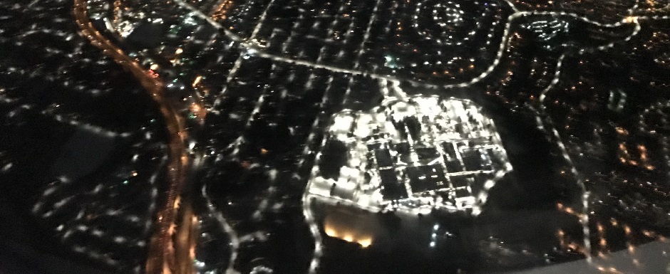 Snow Covered City at Night from a Plane